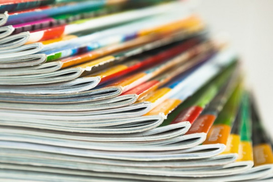 Stack of magazines in different colors