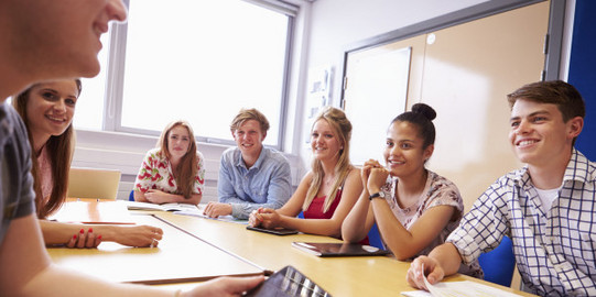 Students in class around square table